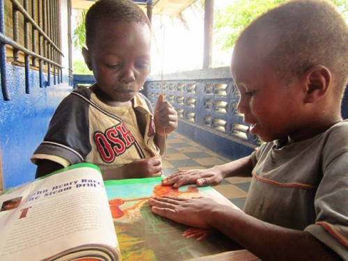 Daniel and Nya with a book